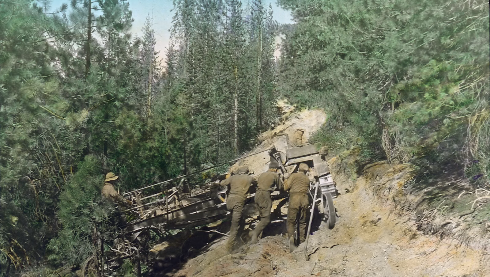 Civilian Conservation Corps enrollees working with a grader on a forest road in 1933
